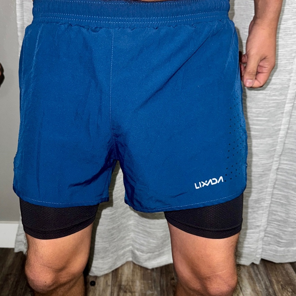 Running shorts with build in compression shorts (blue on top of black)